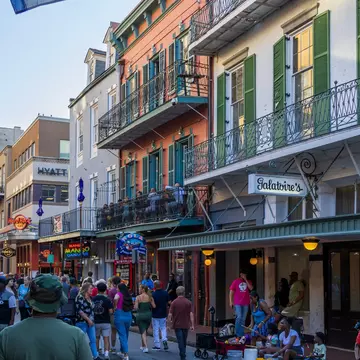 Restaurants and bars along busy Bourbon Street in New Orleans. Marcus E Jones/Shutterstock