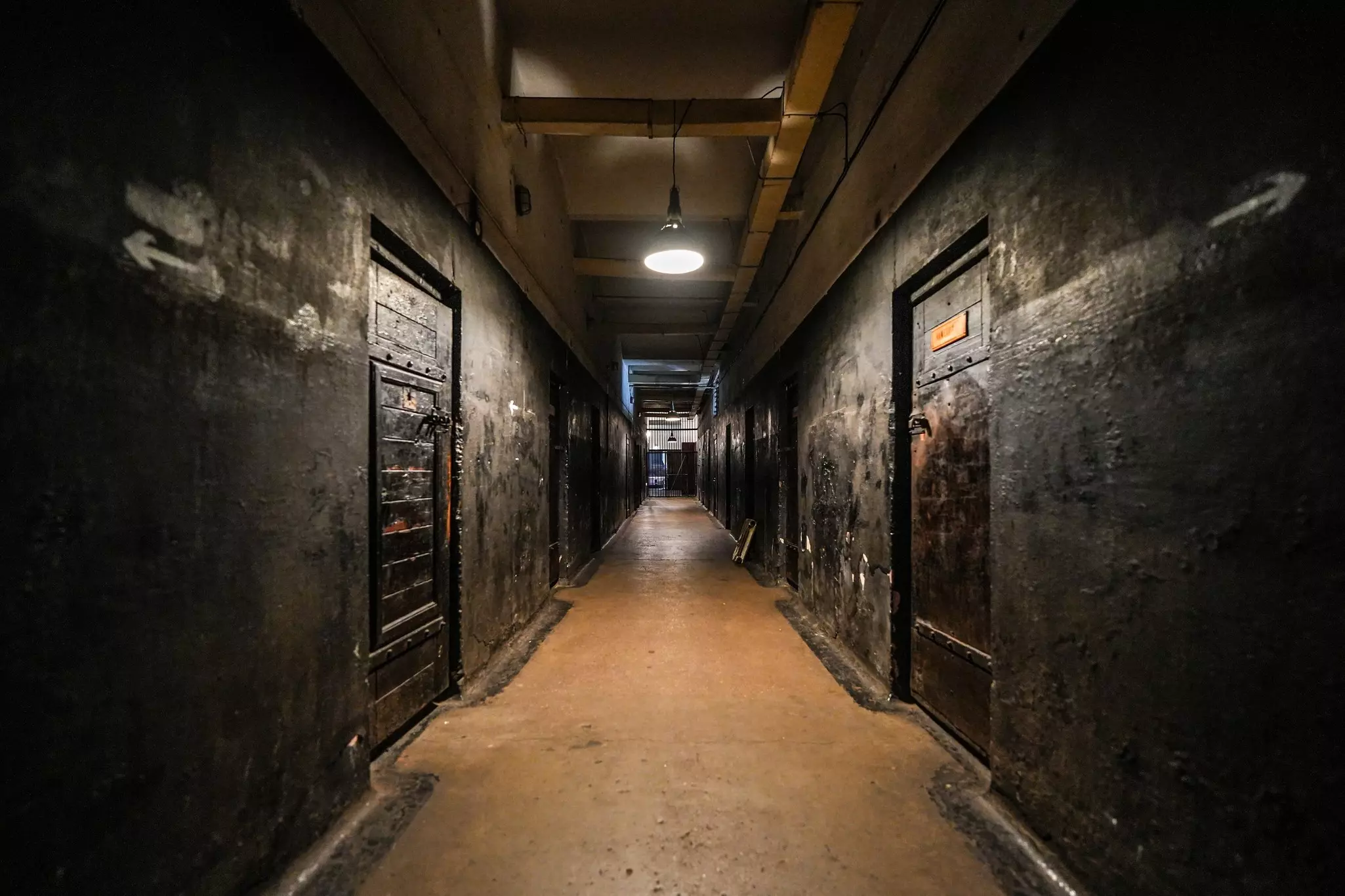 Cell doors line a hallway at Karosta Prison in Liepāja, Latvia.