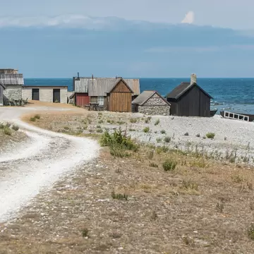 769722457
beach, building, calmness, coast, color image, day, Faro, fishing village, Gotland, gravelled road, horizon, horizon over water, horizontal, house, landscape, no people, outdoors, road, Scandinavia, sea, summer, Sweden, water, winding, wooden house, worn
Helgumannens Fiskeläge Fårö, Sweden