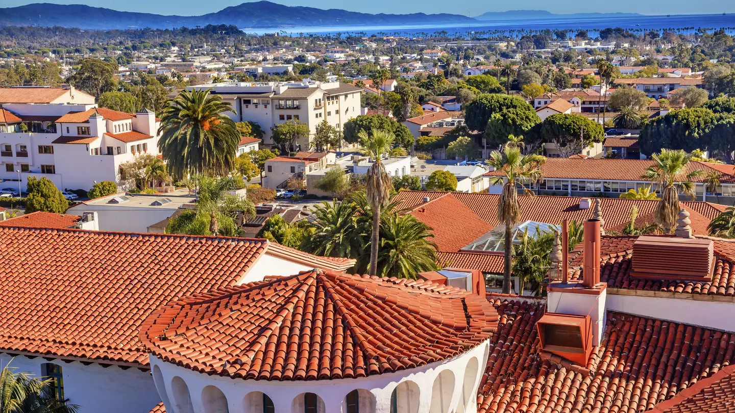 View of Santa Barbara red tile roofs, beach, and mountains