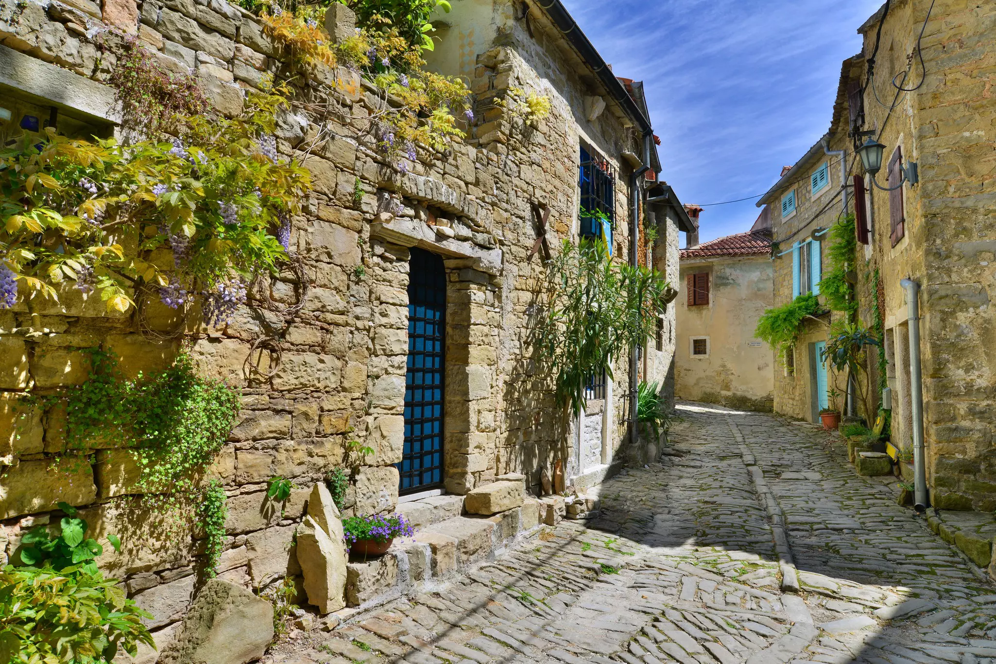 A stone-lined street in the historic village of Groznjan, Istria, Croatia.