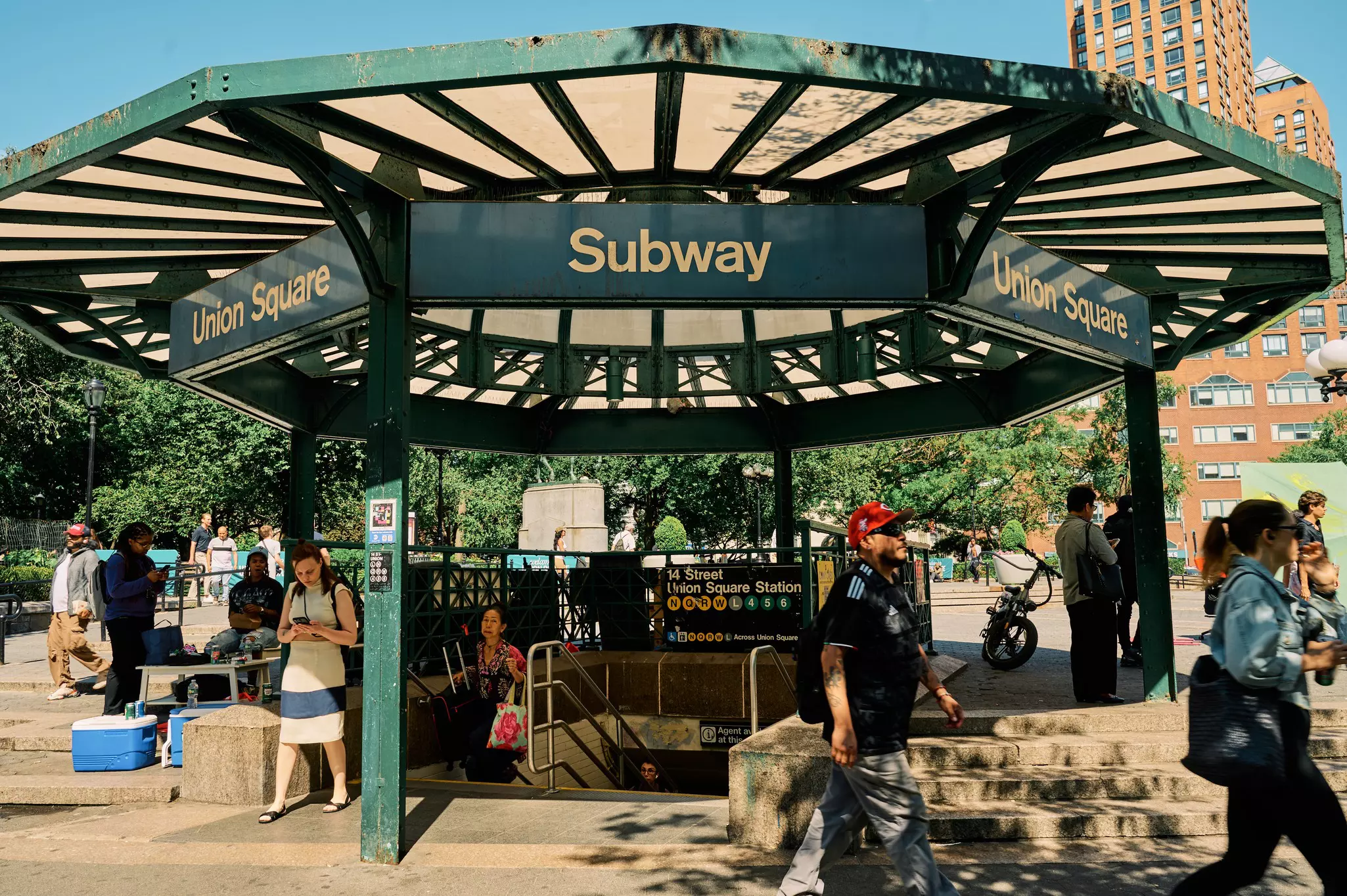People coming in and out of a subway station.