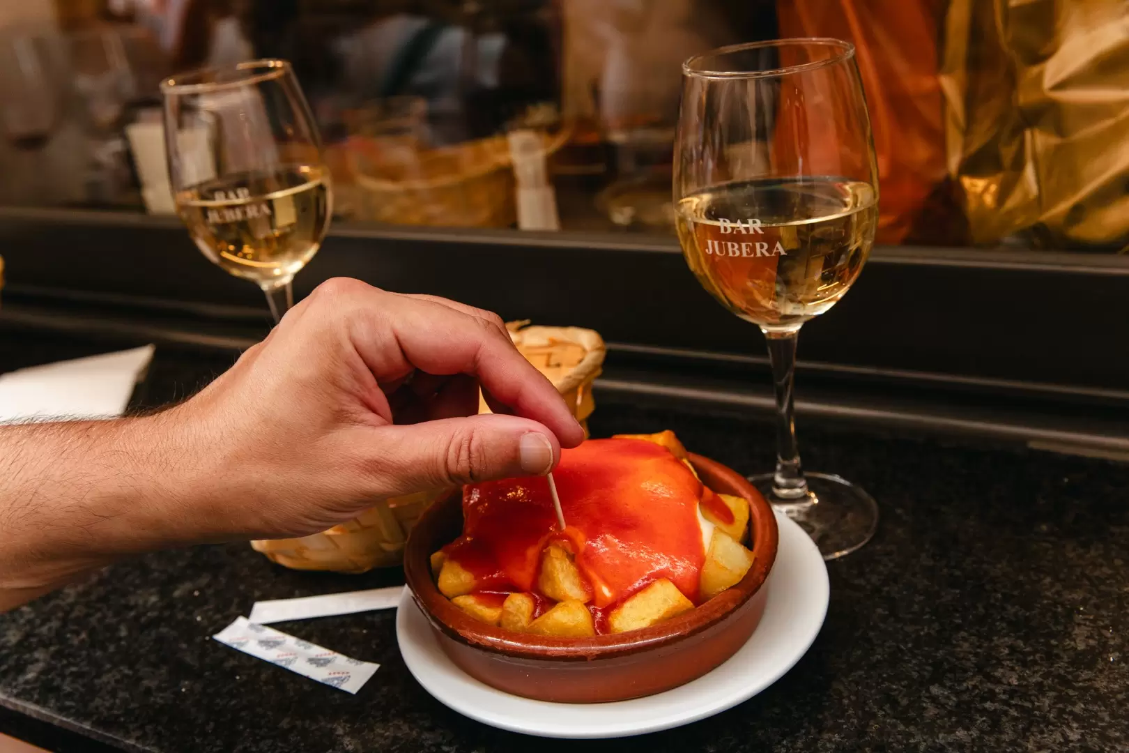 Patatas bravas with semi-sweet Espumoso wine in Logroño, La Rioja, in Spain.