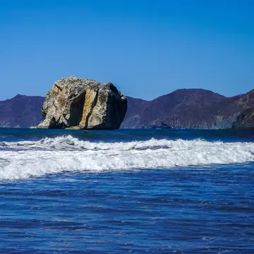 a large rock jutting from the ocean in Costa Rica