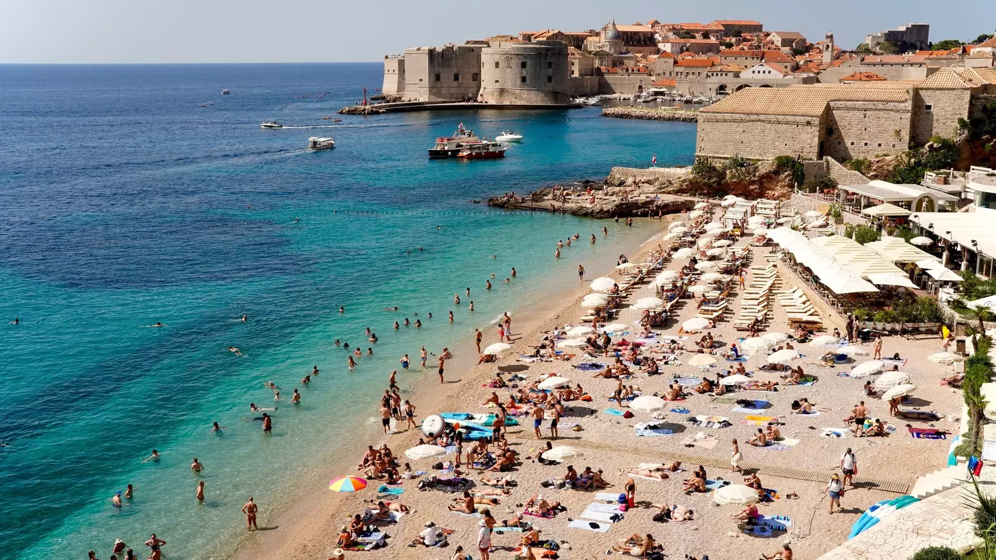 Tourists swiming and sunbathing at Banje Beach, Dubrovknik
