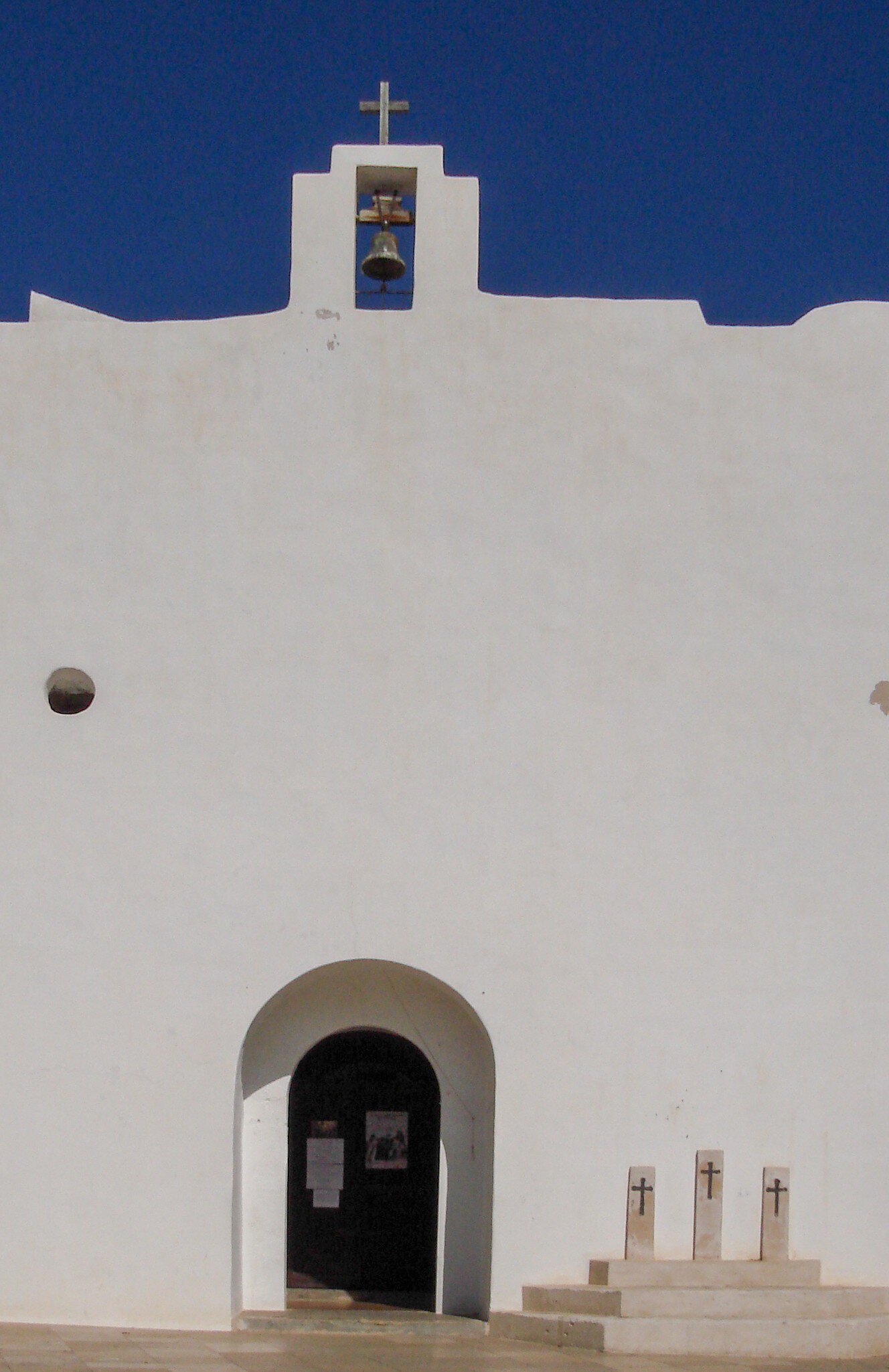 View of the whitewashed walls of the Església de Sant Francesc on the island of Formentera, Spain.