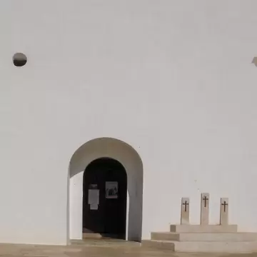 View of the whitewashed walls of the Església de Sant Francesc on the island of Formentera, Spain.