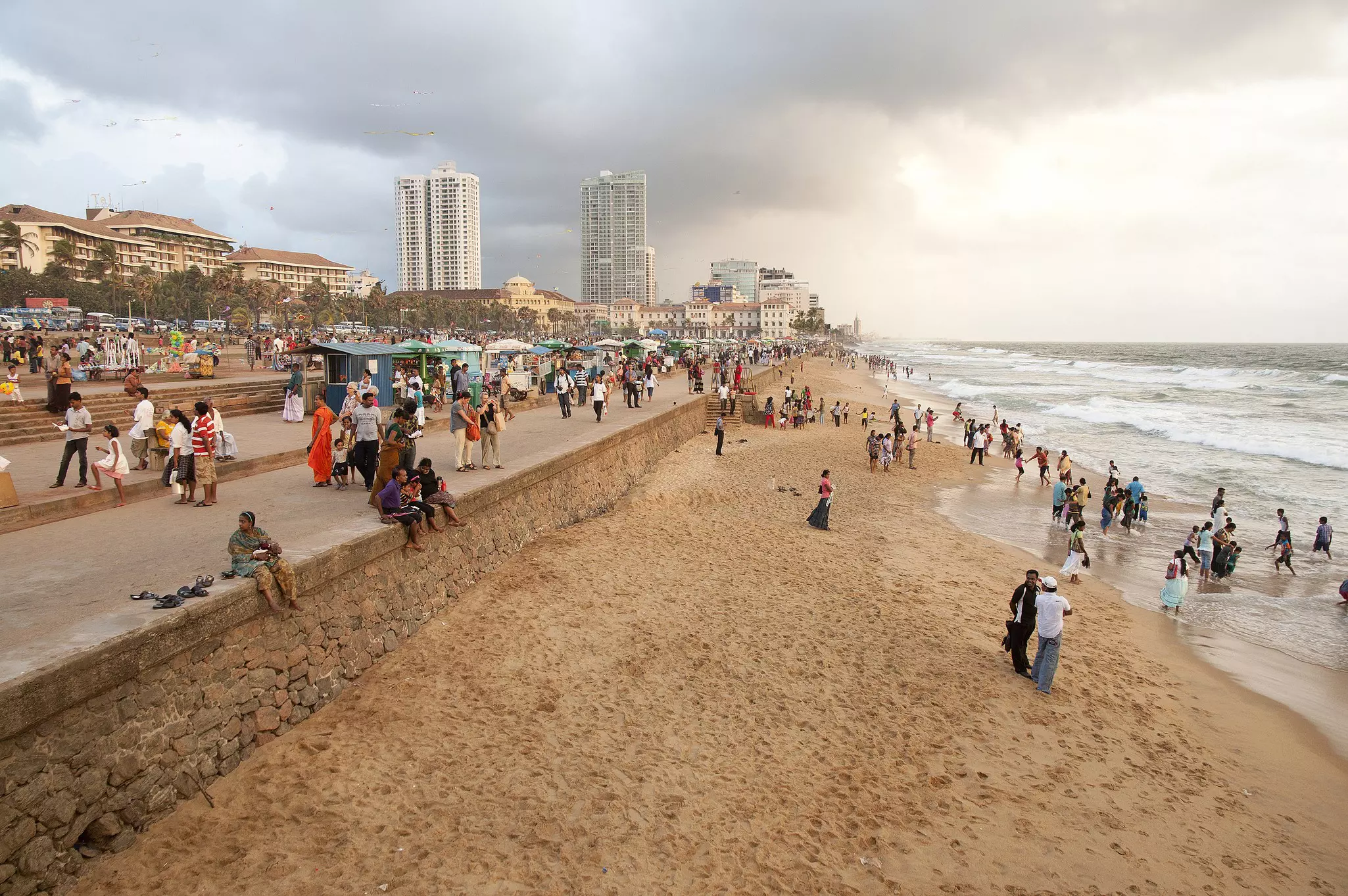 Crowd cool off at city beach by Galle Face Green, Kollupitiya  Colombo.