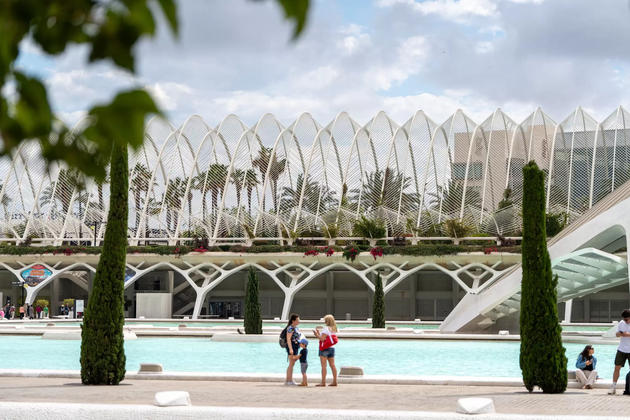View of the parking lot and garden at the Ciudad de las Artes y las Ciencias in Valencia, Spain.
