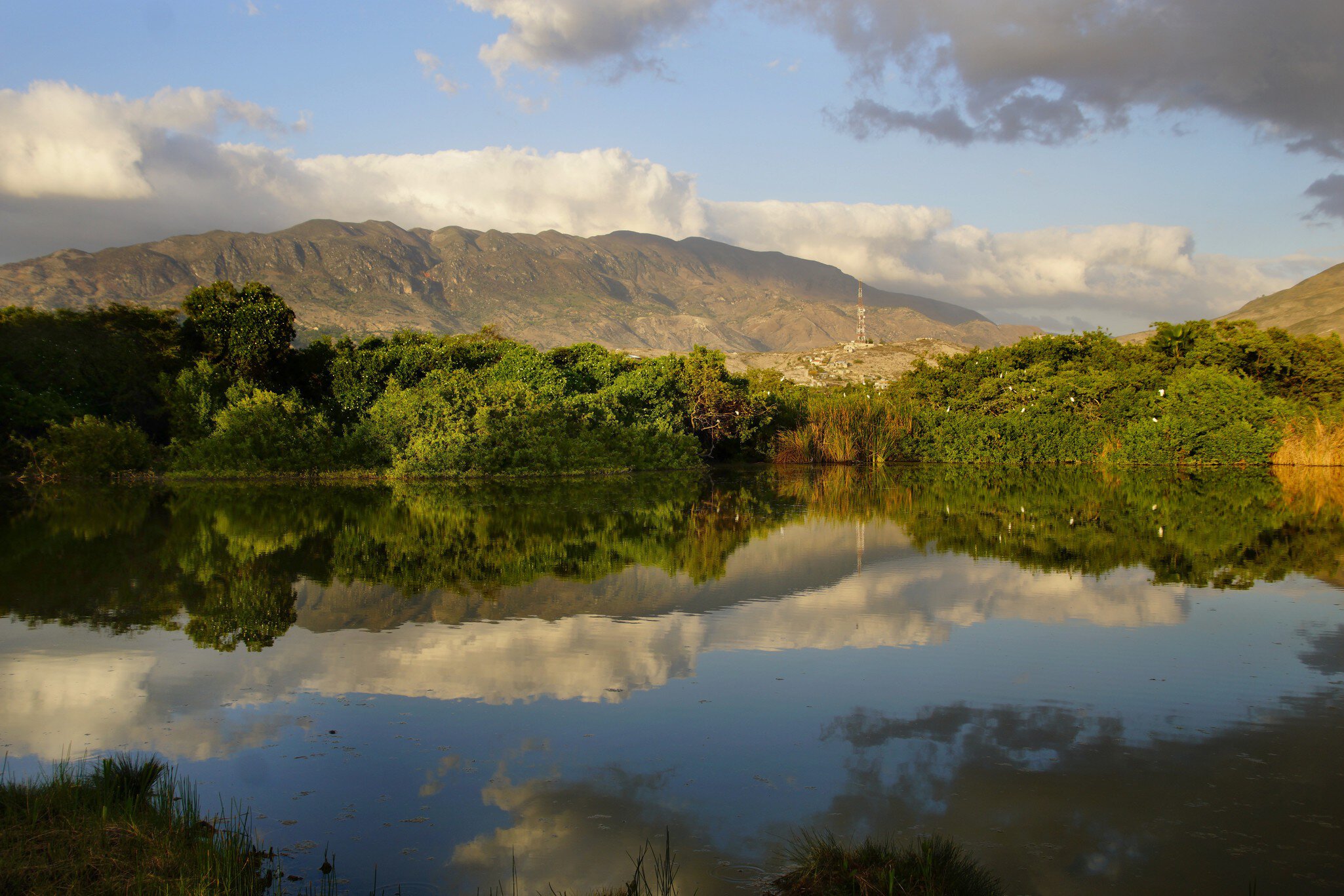 Landscape, Golden hour sunset on the lake, Montrouis, Haiti                               ; Shutterstock ID 404154313; your: Sloane Tucker; gl: 65050; netsuite: Online Editorial; full: Destination Page
404154313