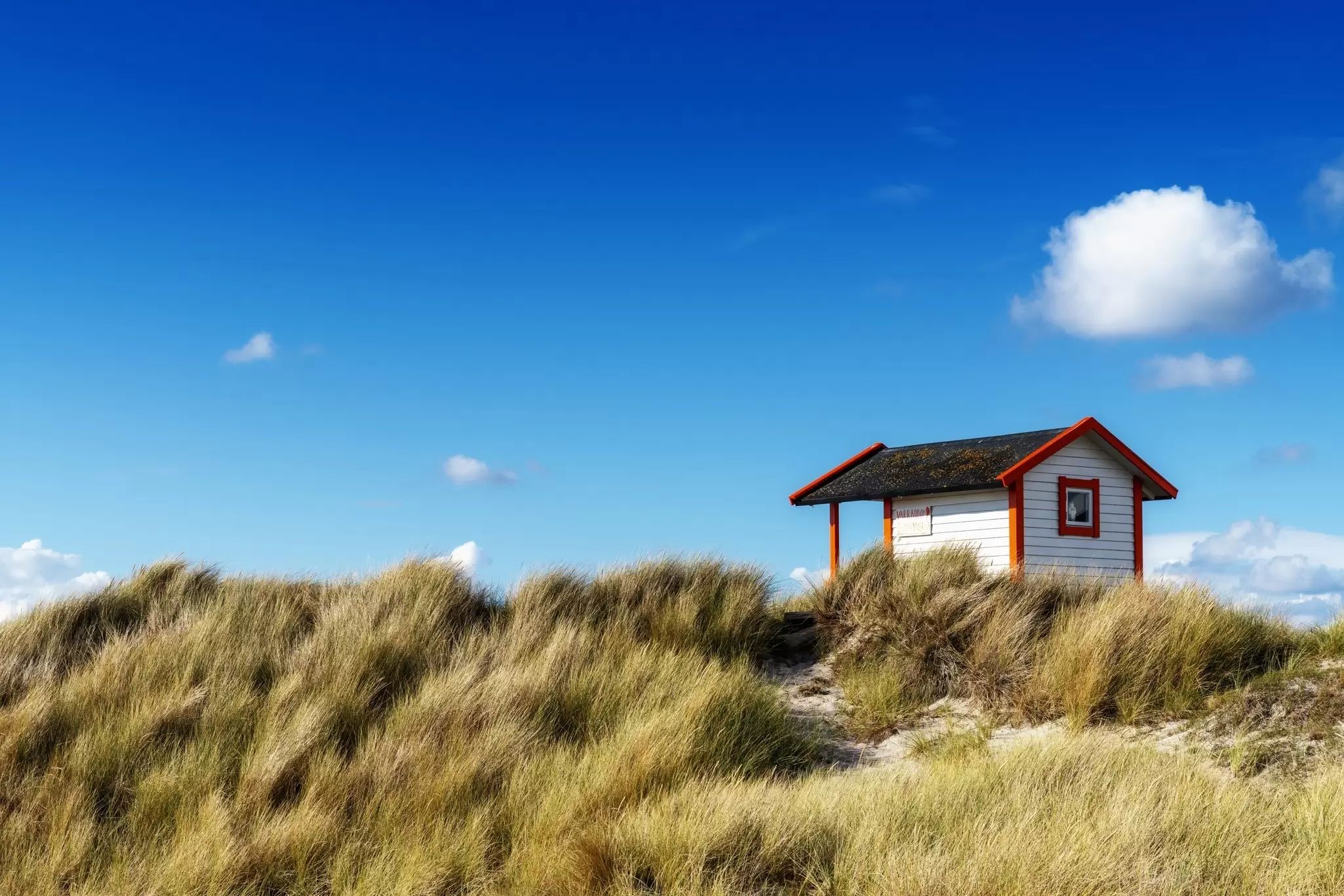 A view of a colourful Badhytta cottage on the Swedish Riviera of the Falsterbo Peninusla,