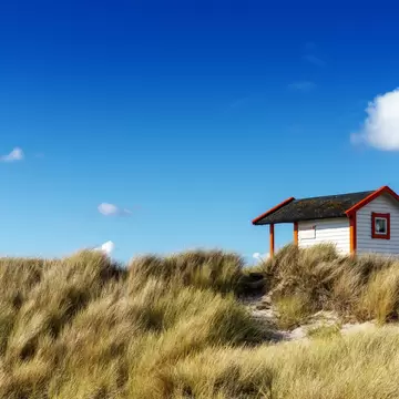 A view of a colourful Badhytta cottage on the Swedish Riviera of the Falsterbo Peninusla,