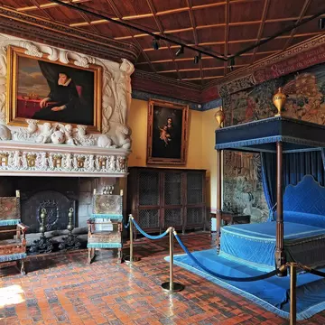Four-poster bed in a luxury guest bedroom at Law Castle