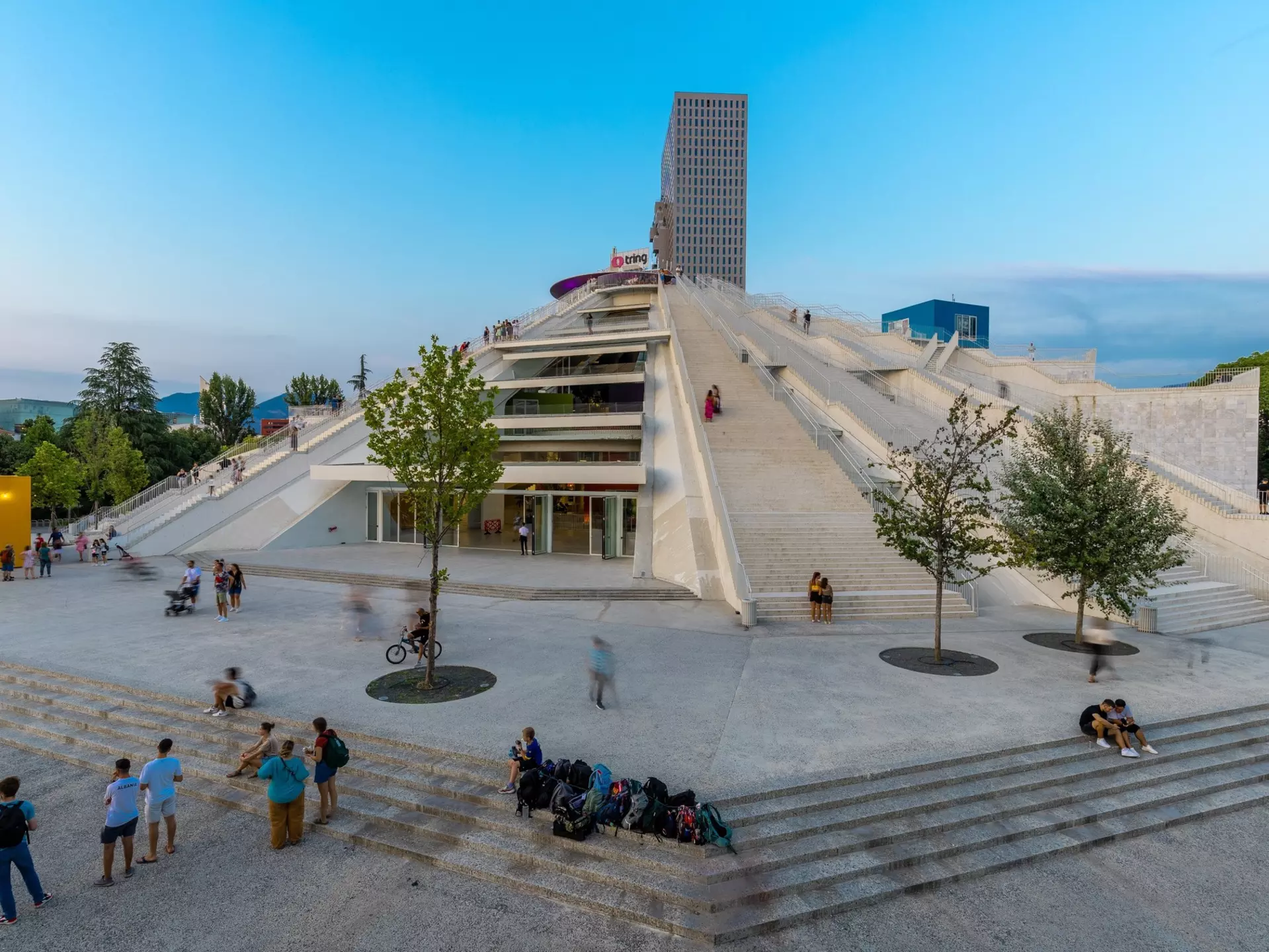 The Pyramid of Tirana at blue hour, locally called the 'Enver Hoxha Mausoleum. Kim Willems / Shutterstock