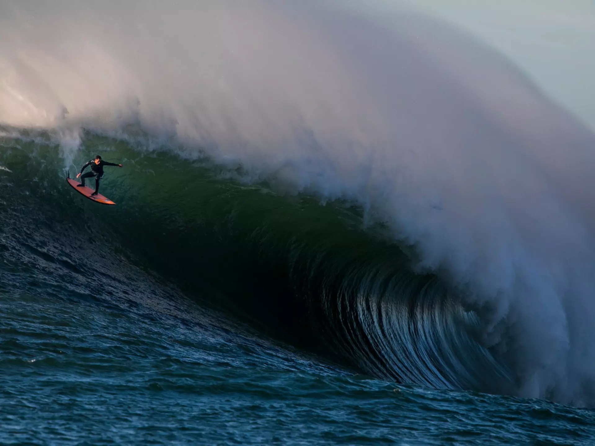 shuttSurfers ride massive waves at Mavericks, a surf break south of San Francisco in California