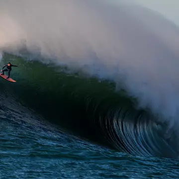 shuttSurfers ride massive waves at Mavericks, a surf break south of San Francisco in California