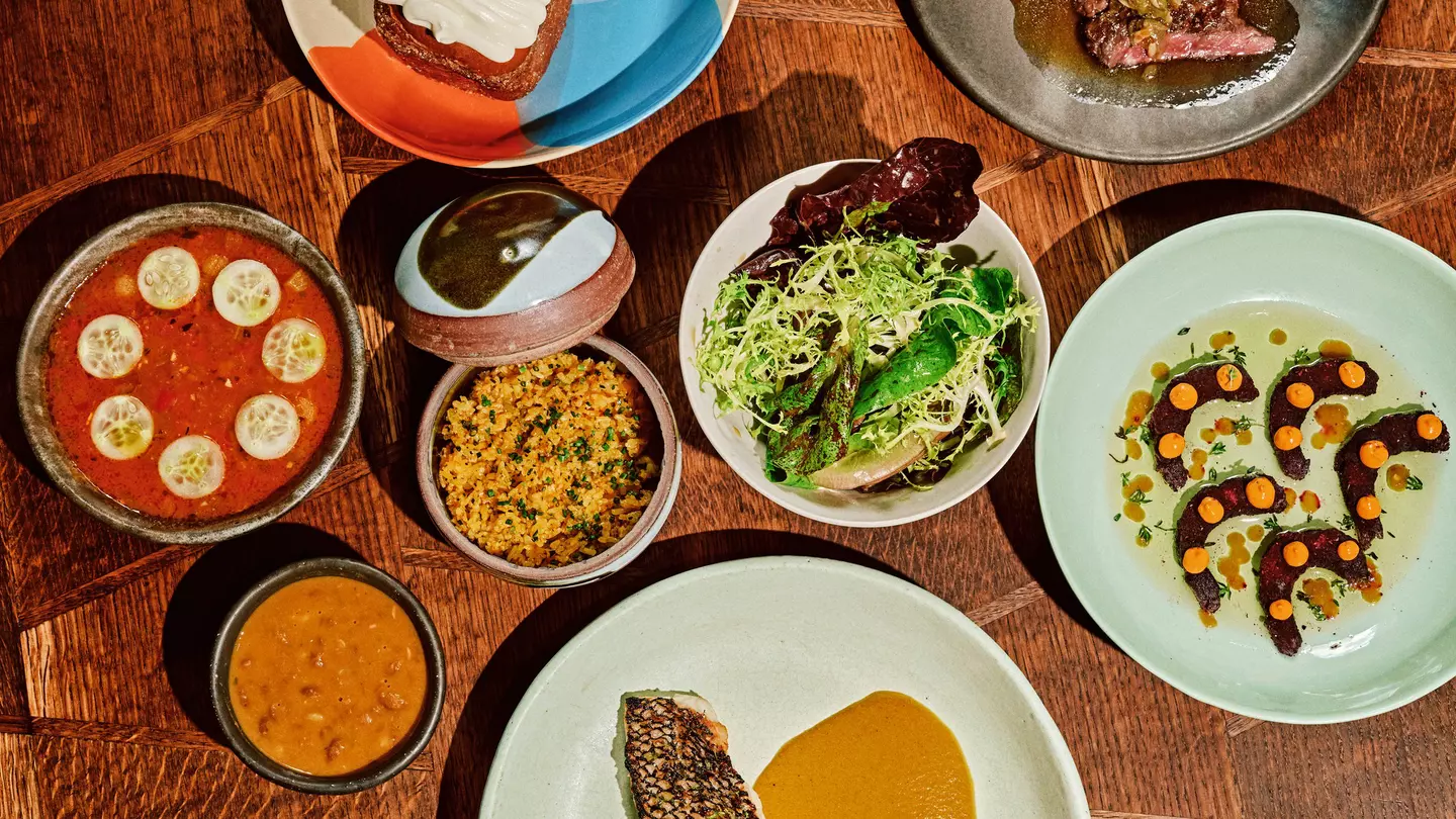 Black bass served with curry, yellow rice, and a side salad, skirt steak, pepper shrimp, cassava dumplings, and the coconut turnover at Kabawa in the East Village, NYC
