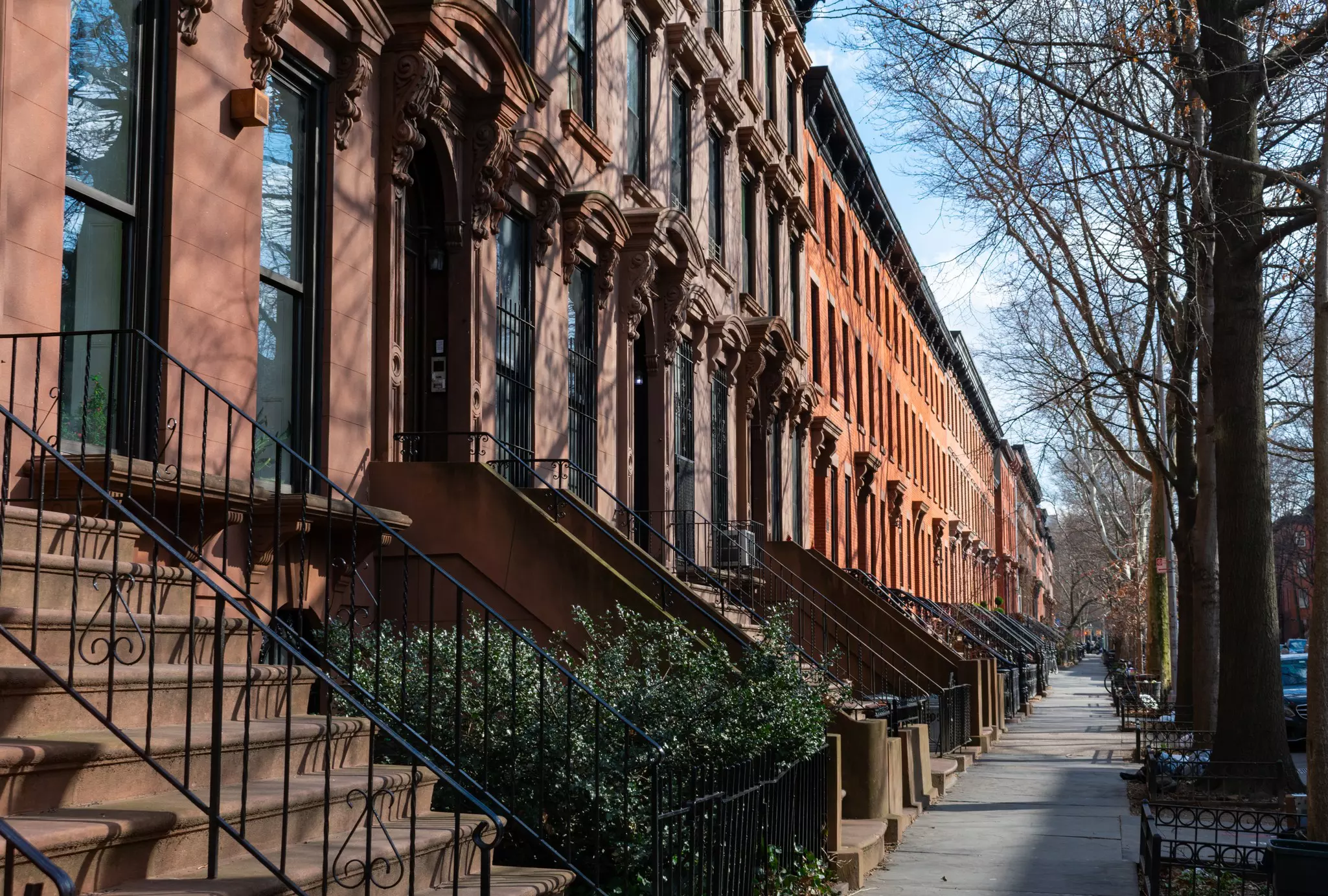 A row of brownstones in Fort Greene Brooklyn New York. James Andrews1/Shutterstock