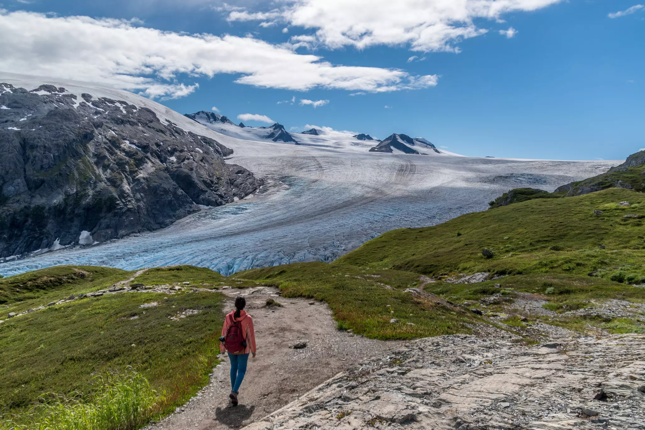 Hiking the Harding Icefield trail in Kenai Fjords National Park with the Exit Glacier in the background. 