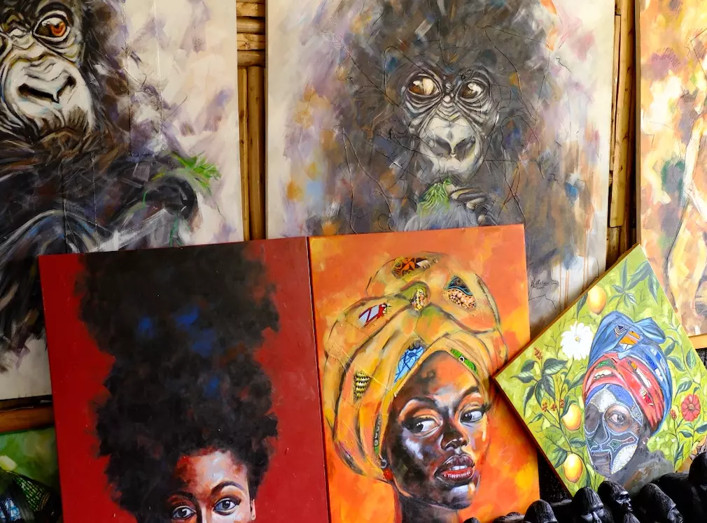 A display with colorful portrait paintings.