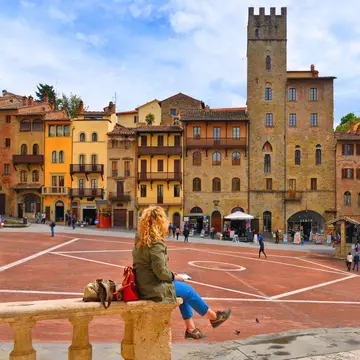April 25, 2019: Woman sitting on a stone handrail at Piazza Grande square in Arezzo.
1534933634
ancient, architecture, arezzo, attraction, building, city, cityscape, culture, destination, europe, european, exterior, facade, famous, heritage, historic, historical, holiday, house, italia, italian, italy, landmark, landscape, medieval, monument, old, outdoor, palace, people, piazza, romantic, sky, square, street, toscana, tourism, tourist, town, travel, tuscany, unesco, urban, vacation, view