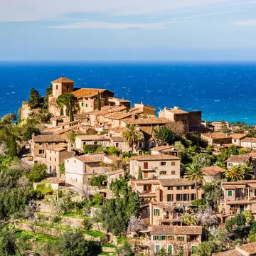 Deià occupies a stunning mountain-top location overlooking the Mediterranean. vulcano / Shutterstock