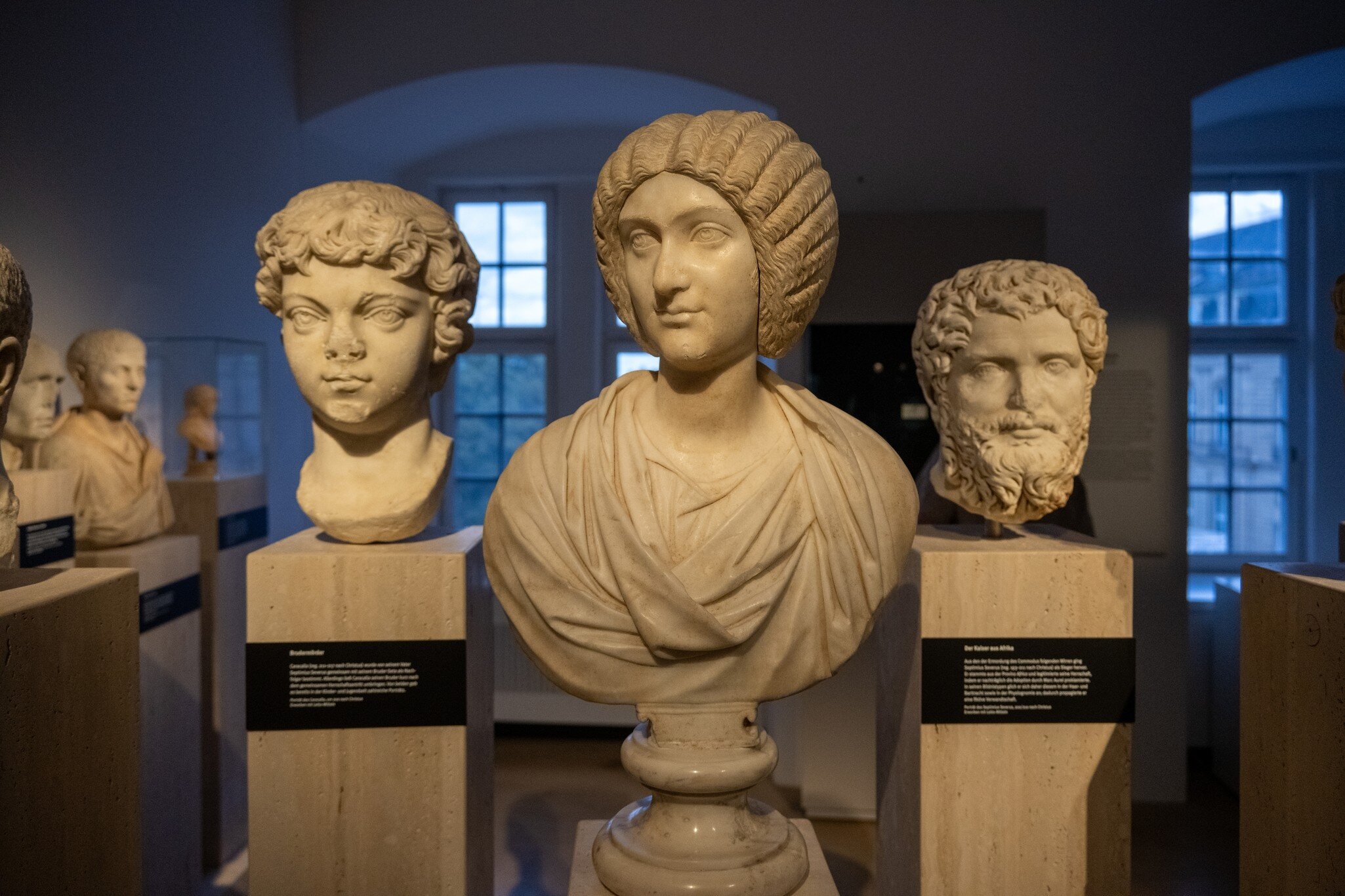Roman marble relief vessels and lidded container displayed at Landesmuseum Württemberg in Stuttgart, Germany.