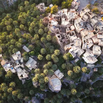 Aerial of an old traditional Omani mud village (Misfat Al Aberyeen) in the mountains among date palm trees.
753342523
landscape, abstract, aerial, ancient, architecture, background, building, clay, contrast, copy space, culture, date, desert, flying, forest, gulf, habitat, home, house, hut, light, middle east, misfat al aberyeen, mountain, mud, muscat, old, oman, omani, outdoors, palm, quiet, sand, shadow, sunny, sunset, text space, tourism, town, traditional, trees, village