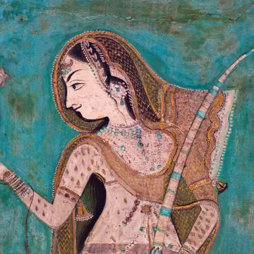 Painting of a woman holding a brid from the 1700's in the Bundi Palace. ©traveler1116/Getty Images