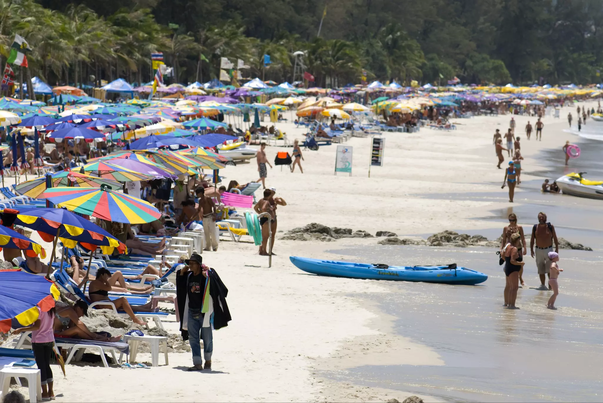 Sunbeds and beach umbrellas on Patong Beach, Phuket, Thailand.
