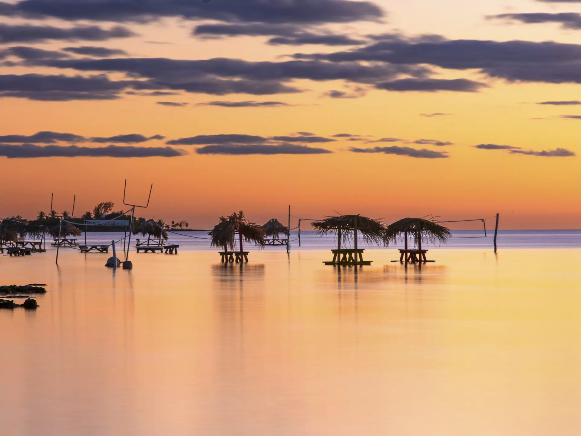 Tables sit in the water at Secret Beach, Ambergris Caye, Belize. Matthew Micah Wright/Getty Images