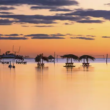 Tables sit in the water at Secret Beach, Ambergris Caye, Belize. Matthew Micah Wright/Getty Images