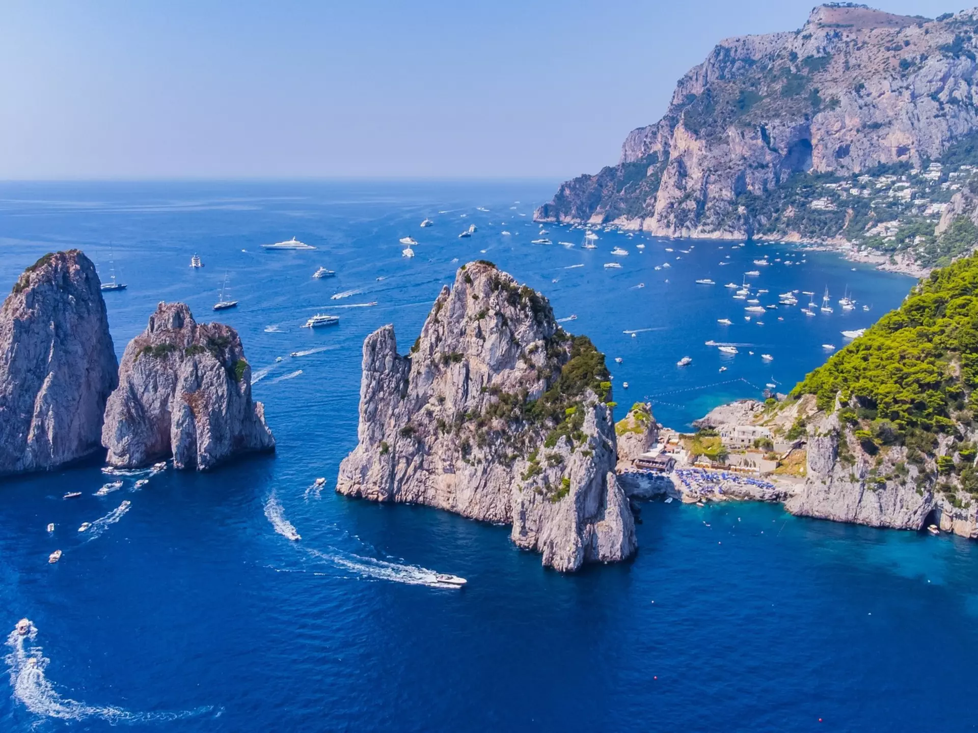Boats cruising off the coast near Naples in Southern Italy. Jayne Lipkovich/Shutterstock