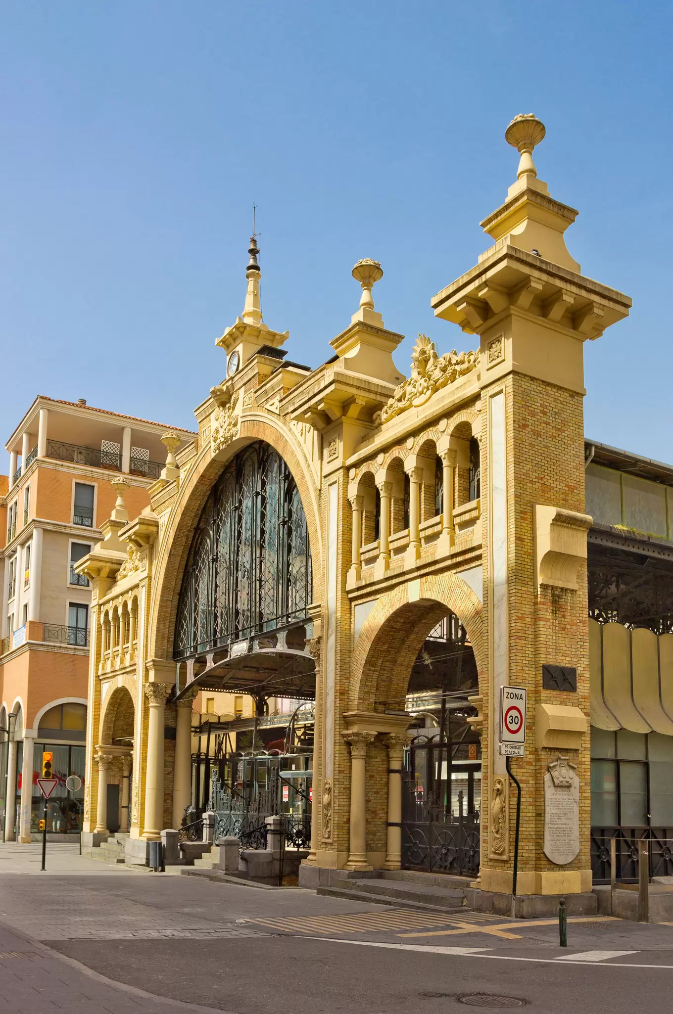The sun lights up the elegant frontage of the Mercado Central in Zaragoza, Spain.