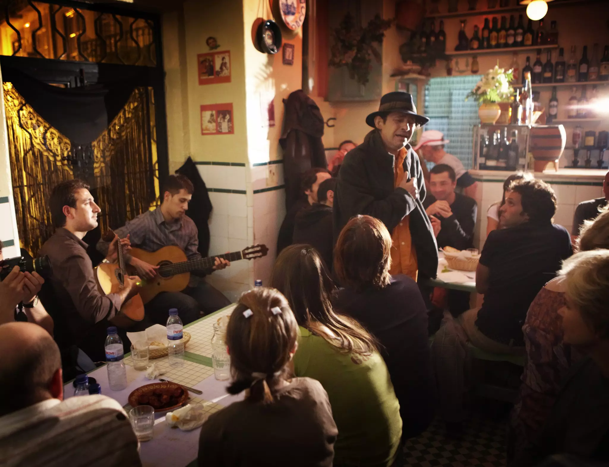 A singer and musicians perform at a bar in Portugal.