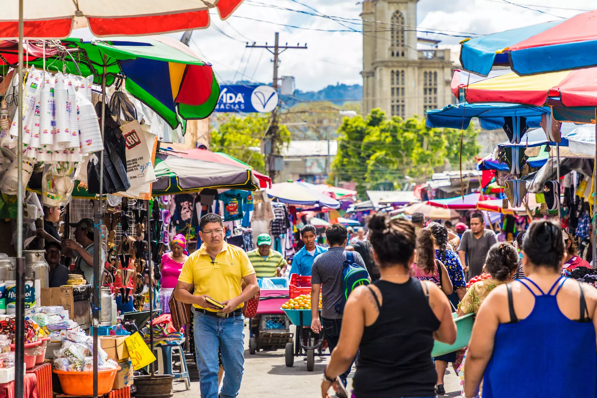 People walking through a street market.