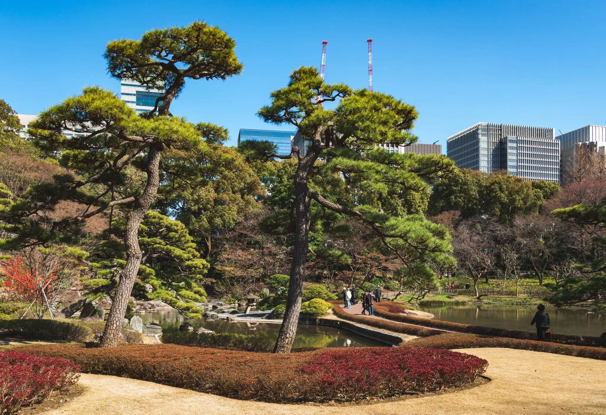 March 24, 2015: Landscaped gardens of the Imperial Palace East Gardens with the skyscrapers of the 'Marunouchi' district in the background.
635479762
60595; Asia; Cultures; Photography; Pond; Public Park; Capital Cities; City; Nature; No People; Ornamental Garden; Outdoors; Zen-like; Formal Garden; Grass; Green Color; Horizontal; Idyllic; Imperial Palace - Tokyo; Skyscraper; Springtime; Tokyo - Japan; Tourism; Japan; Kokyo Higashi-gyoen; Landscape; Landscaped; Lawn; Tranquil Scene; Tree; Water;