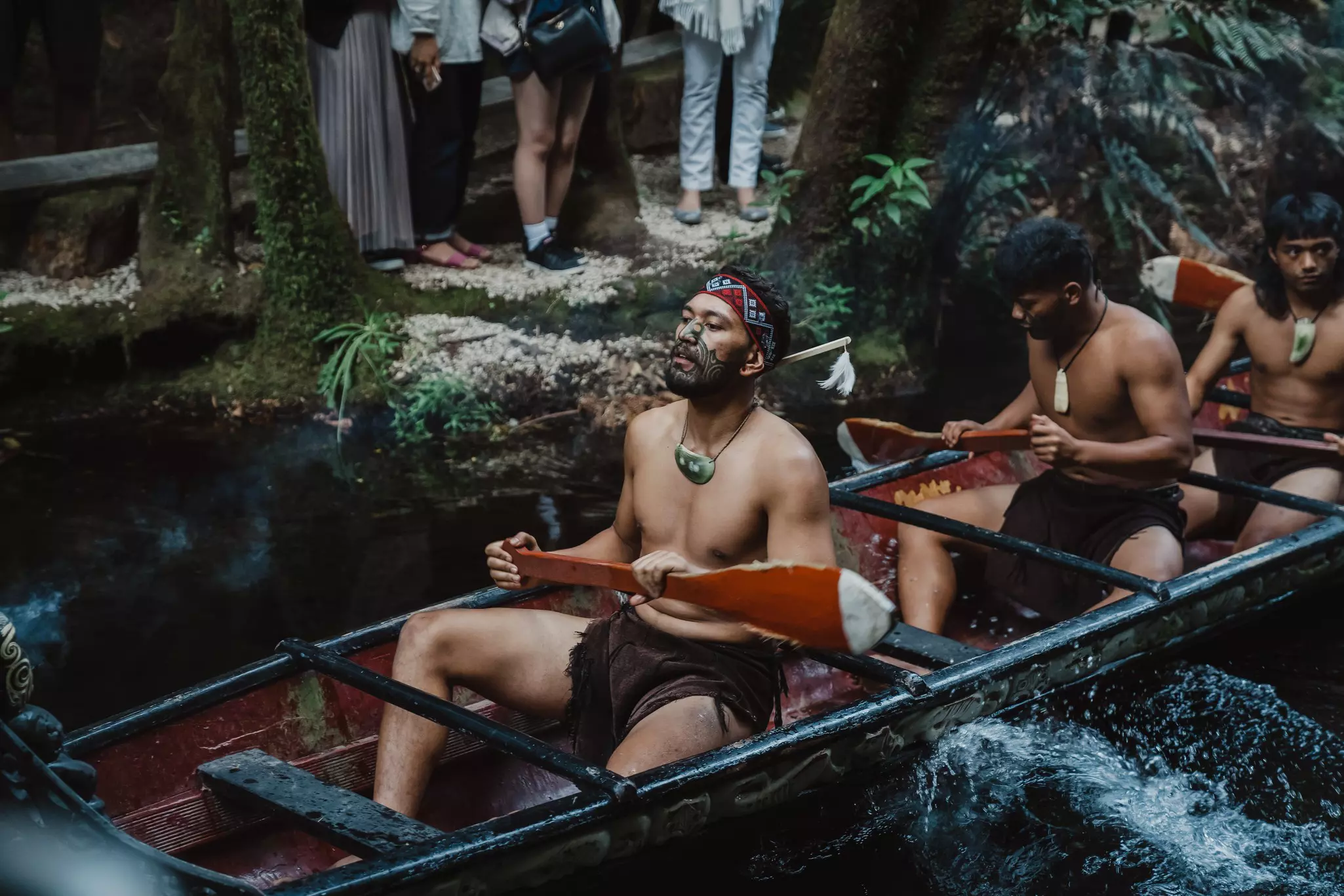 Maori guys show performance to the audience in Mitai Maori village, New Zealand.