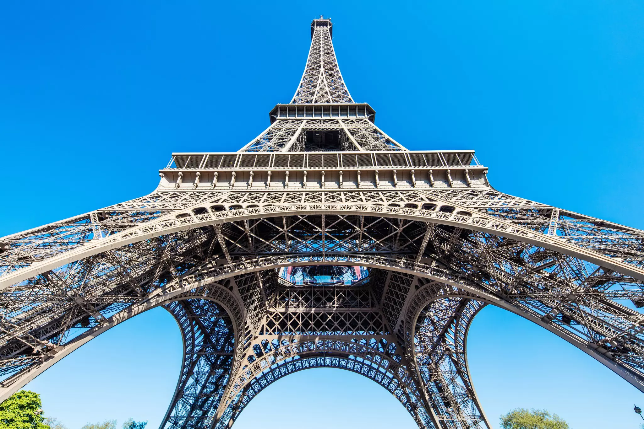 A view looking up at the Eiffel Tower in Paris, France.