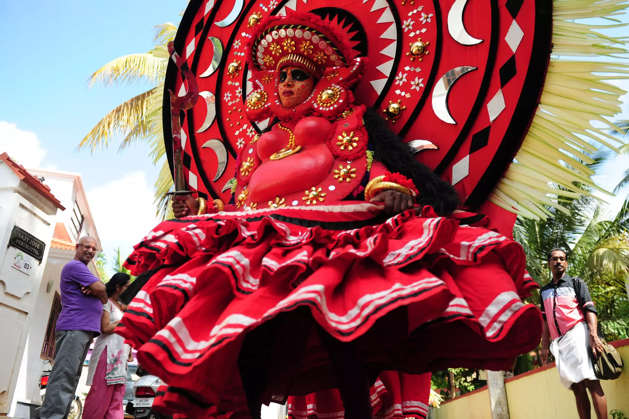 An Indian Theyyam artist performs during the Kummati Kali as part of the annual Onam festival celebrations in Thrissur, Kerala, India