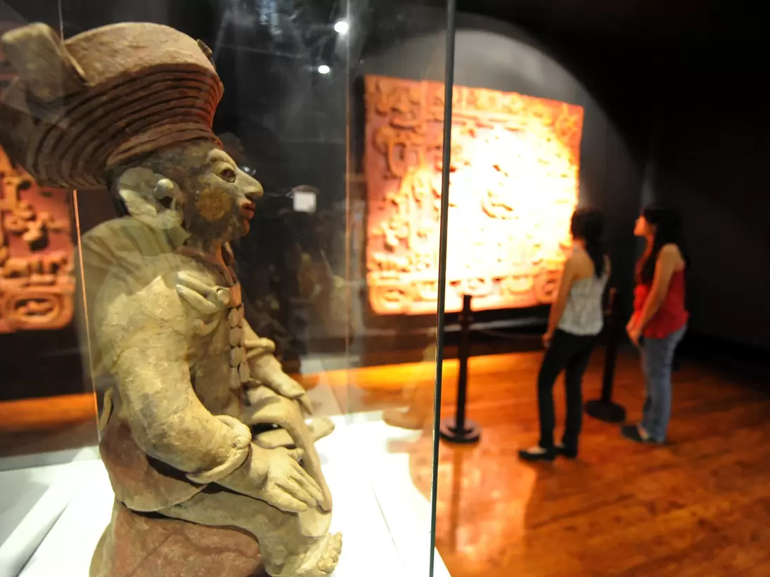 Visitors learn about the Mayas at the Museum of National Identity in Tegucigalpa on December 14, 2012. The beginning of a new Mayan era on December 21 will be marked with celebrations throughout southern Mexico and Central America. Honduras is one...