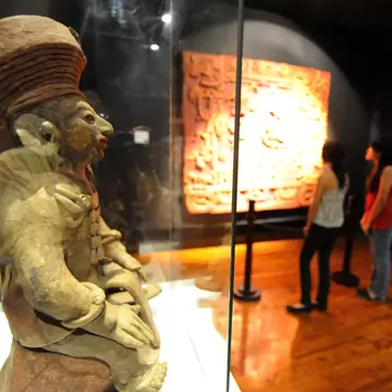 Visitors learn about the Mayas at the Museum of National Identity in Tegucigalpa on December 14, 2012. The beginning of a new Mayan era on December 21 will be marked with celebrations throughout southern Mexico and Central America. Honduras is one...