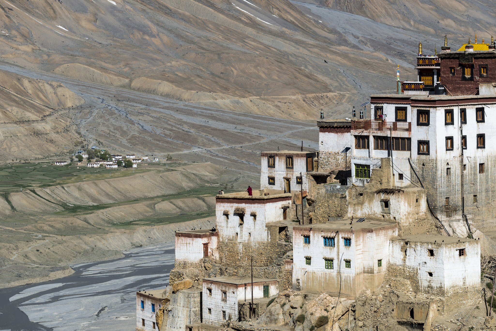 Aerial view on Ki Gompa, a Tibetan Buddhist monastery located on top of a hill at an altitude of 4,166 metres, the Spiti Valley in the background. Himachal Pradesh, India.