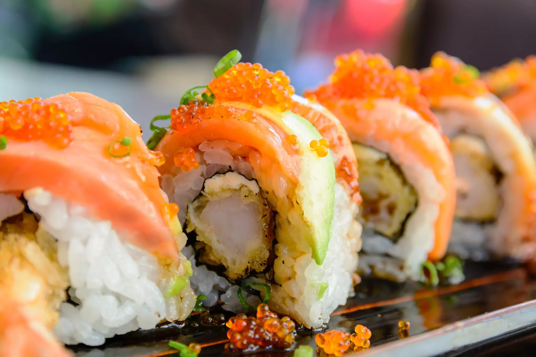 Sushi rolls with salmon and shrimp tempura.