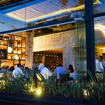 Open window of an upscale restaurant in Polanco in Mexico City, Mexico. Inspired By Maps/Shutterstock