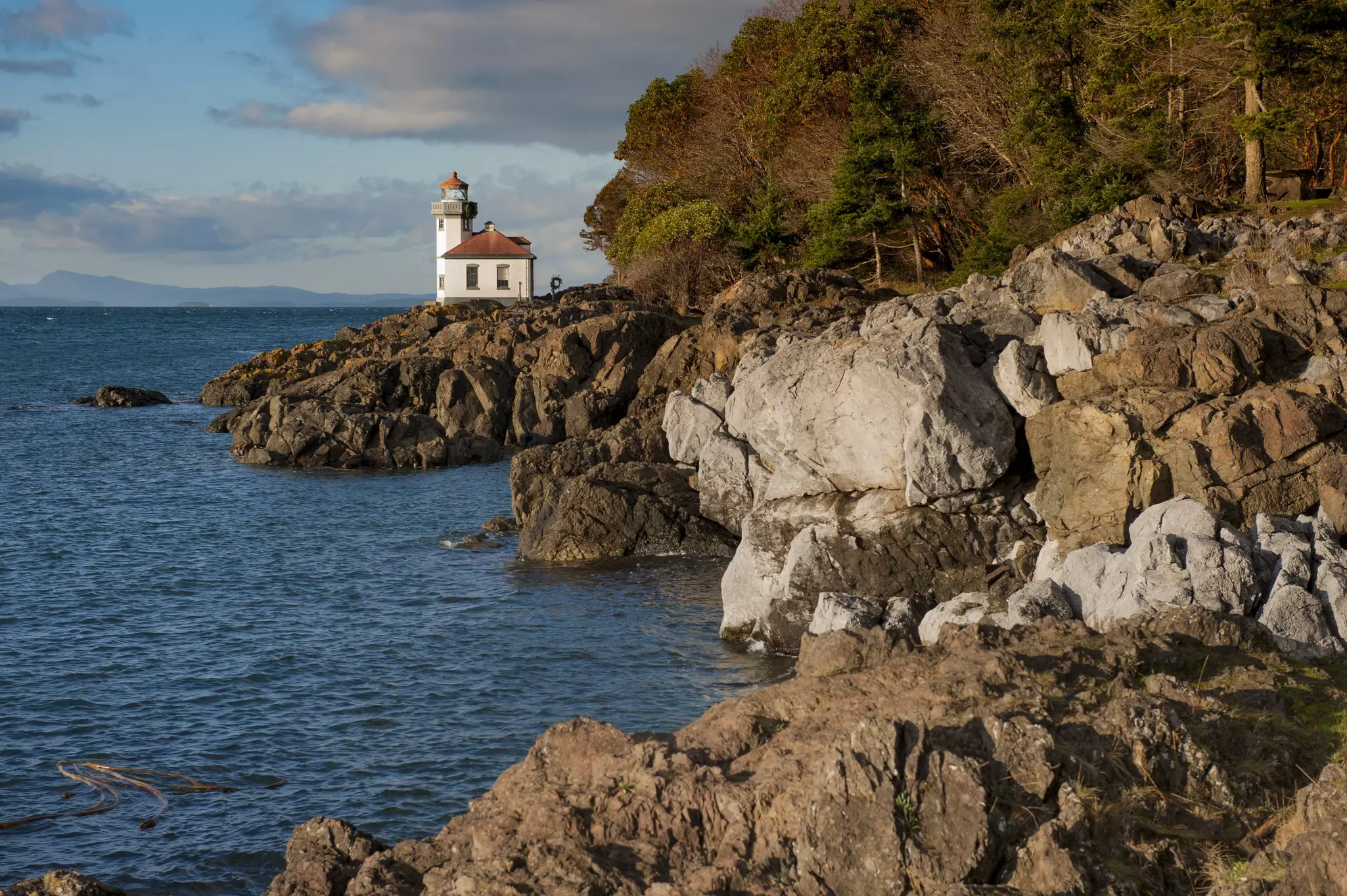 Lime Kiln Lighthouse. Located on San Juan Island, in Washington state, It guides ships through the Haro Straits and is part of Lime Kiln Point State Park. It overlooks Dead Mans Bay.