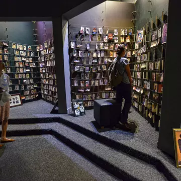 KIGALI, RWANDA - SEPTEMBER 2019: Tourists visiting the National Memorial to the victims of Genocide on September 25, 2019 in Kigali, Rwanda.