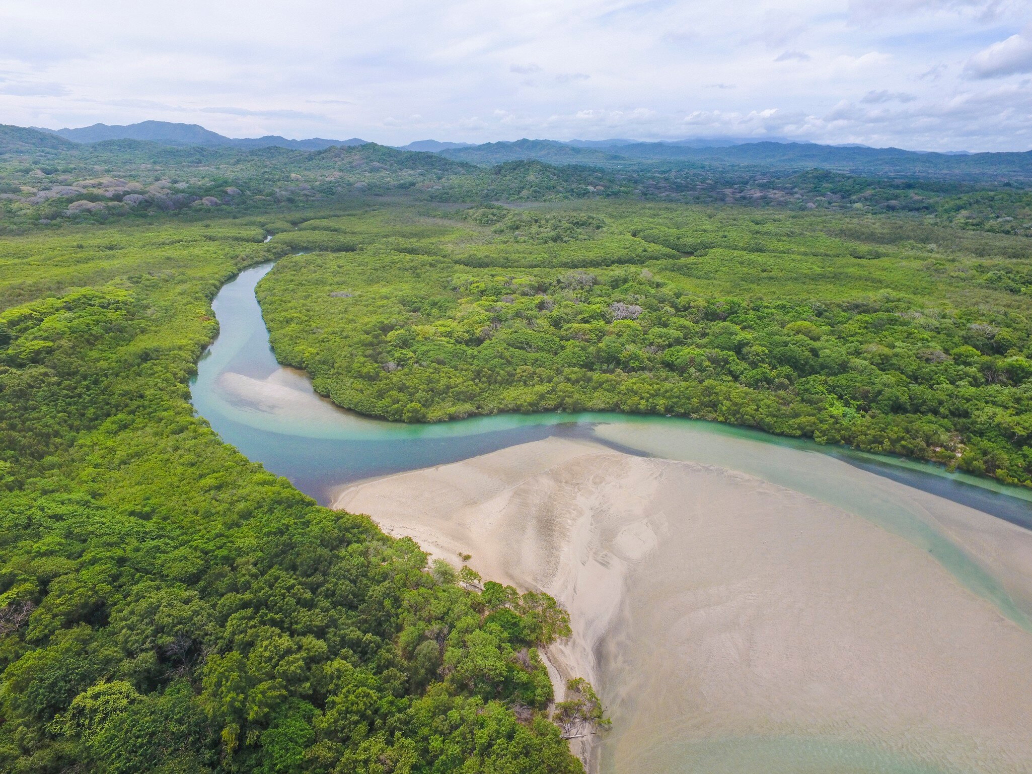 Aerial view of Playa Langosta, a beautiful white sand beach.