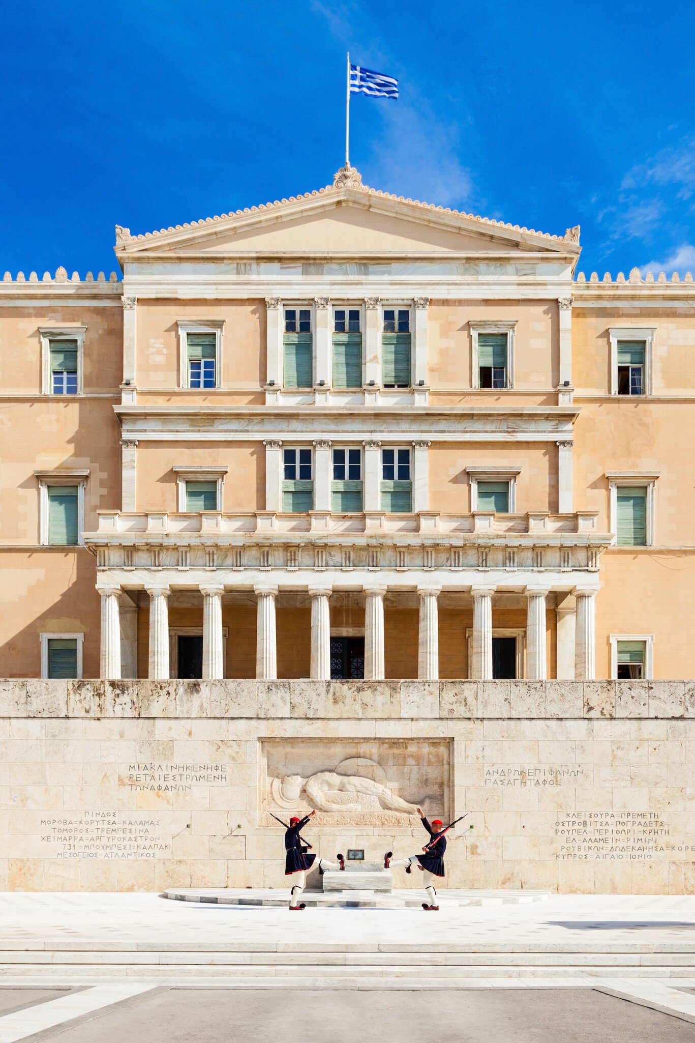 View of guards marching past the Tomb of the Unknown Soldier at the Hellenic Parliament in Athens, Greece.