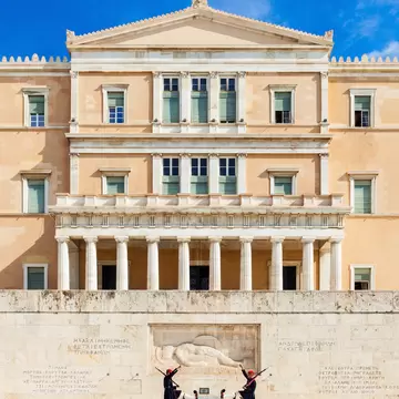 View of guards marching past the Tomb of the Unknown Soldier at the Hellenic Parliament in Athens, Greece.